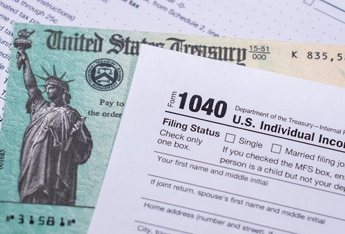 Us,Treasury,Stimulus,Check,Laying,On,A,Form,1040,Tax